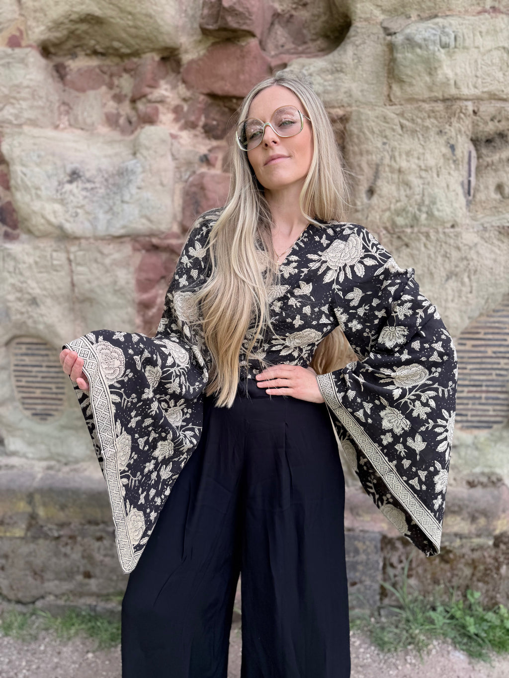 The Sofiya: Bell Sleeve Block Print Wrap Blouse in Black Floral
