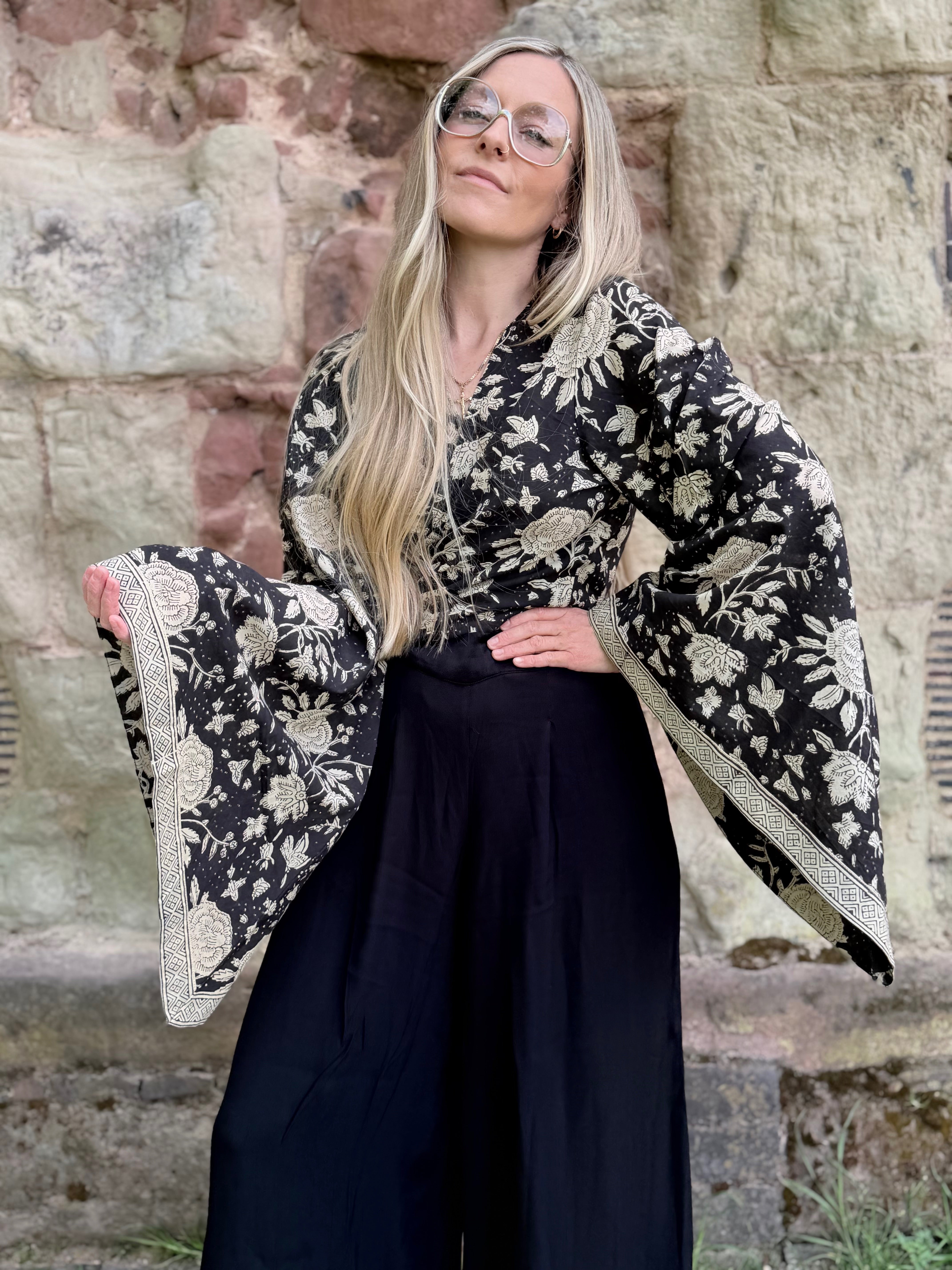 The Sofiya: Bell Sleeve Block Print Wrap Blouse in Black Floral