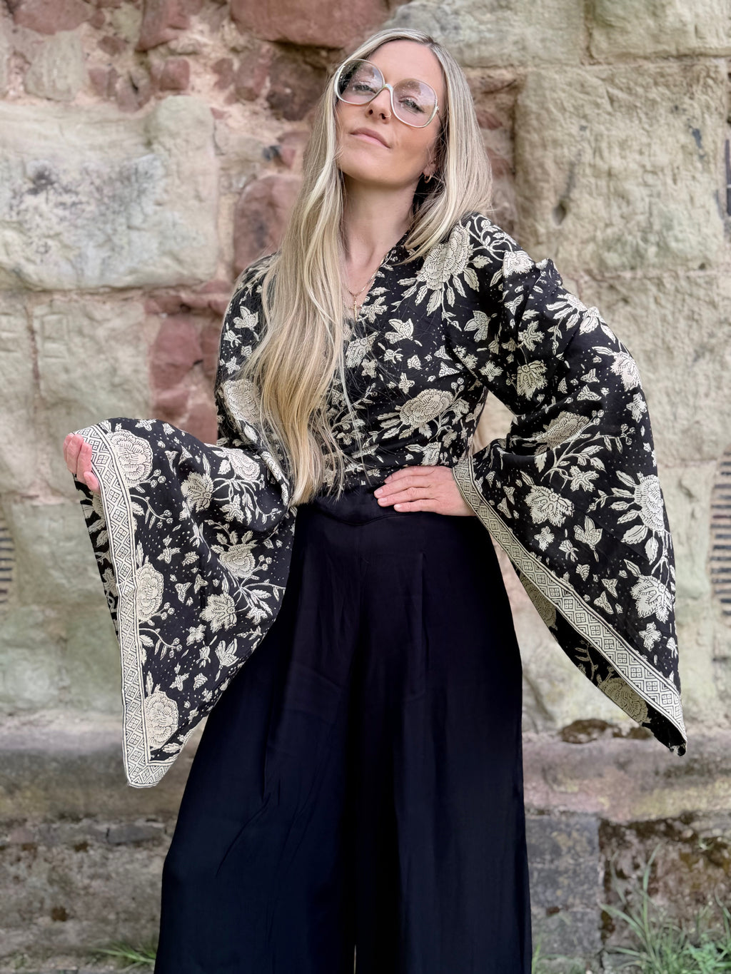 The Sofiya: Bell Sleeve Block Print Wrap Blouse in Black Floral