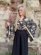 The Sofiya: Bell Sleeve Block Print Wrap Blouse in Black Floral