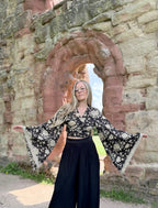 The Sofiya: Bell Sleeve Block Print Wrap Blouse in Black Floral