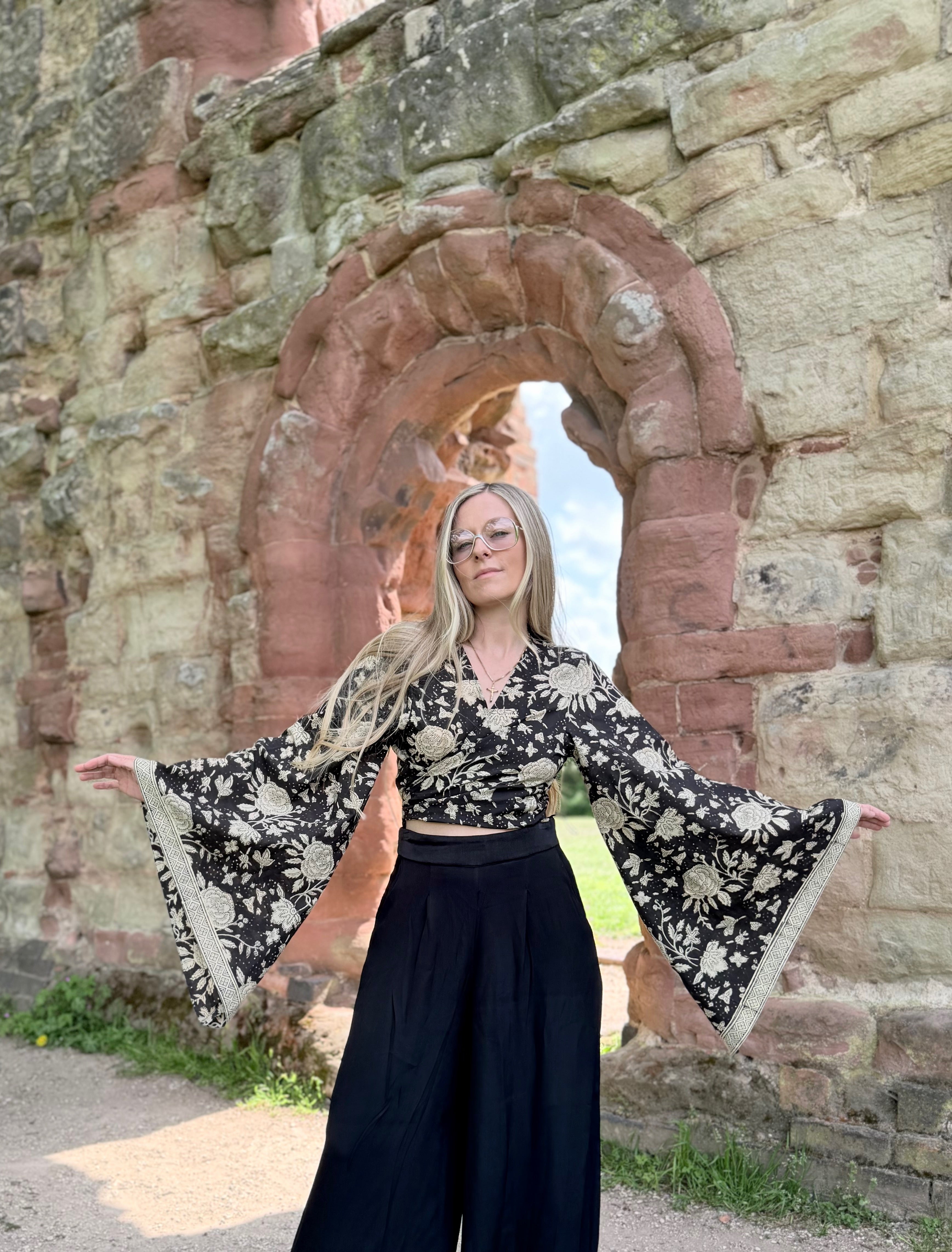 The Sofiya: Bell Sleeve Block Print Wrap Blouse in Black Floral