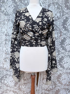 The Sofiya: Bell Sleeve Block Print Wrap Blouse in Black Floral