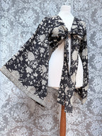 The Sofiya: Bell Sleeve Block Print Wrap Blouse in Black Floral